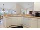 Efficient kitchen with white cabinets and corner sink at 2295 Chilcote Ter, Port Charlotte, FL 33981