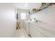 Clean laundry room with washer, dryer, and shelving at 2295 Chilcote Ter, Port Charlotte, FL 33981