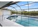 Enclosed pool area with water views at 2295 Chilcote Ter, Port Charlotte, FL 33981