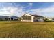 Large backyard with grassy lawn and house at 23111 Mineral Ave, Port Charlotte, FL 33954