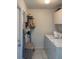 Laundry room with washer, dryer, and shelving at 23111 Mineral Ave, Port Charlotte, FL 33954