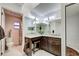 Well-lit bathroom with granite vanity, modern fixtures, and separate toilet and tiled shower area at 232 Southampton Ln # 259, Venice, FL 34293