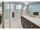 Modern bathroom featuring a spacious glass shower and a granite countertop vanity at 232 Southampton Ln # 259, Venice, FL 34293