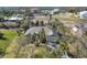 Aerial view of a home surrounded by lush trees and other homes at 235 Capstan Dr, Placida, FL 33946