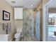 Bathroom featuring a glass shower with a view of the pool and outdoor area at 235 Capstan Dr, Placida, FL 33946