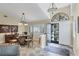 Elegant dining room with tile floors, shuttered window and an arched doorway at 235 Capstan Dr, Placida, FL 33946