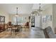 Open-concept dining area with unique chairs, tile floors, and lots of natural light at 235 Capstan Dr, Placida, FL 33946