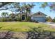 Charming single Gathering home with a well-manicured lawn and tropical landscaping at 235 Capstan Dr, Placida, FL 33946