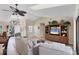 Cozy living room featuring tile floors, a ceiling fan, and stylish decor at 235 Capstan Dr, Placida, FL 33946