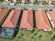 Aerial view of houses with pools and screened enclosures at 24269 Spartina Dr, Venice, FL 34293