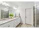 Double vanity bathroom with granite countertop and large shower at 24269 Spartina Dr, Venice, FL 34293