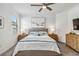 Relaxing bedroom with a comfortable bed, stylish nightstands, and calming decor at 24269 Spartina Dr, Venice, FL 34293