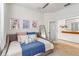 Guest bedroom with a daybed, decorative pillows, and built in shelving at 24269 Spartina Dr, Venice, FL 34293