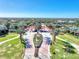 Grand entrance to Sarasota National with flagpoles at 24269 Spartina Dr, Venice, FL 34293