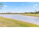 Peaceful pond view with lush green landscaping at 24269 Spartina Dr, Venice, FL 34293