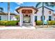 Community pool and fitness center entrance with covered walkway at 24269 Spartina Dr, Venice, FL 34293