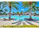 Expansive resort pool with surrounding palms at 24269 Spartina Dr, Venice, FL 34293