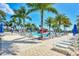 Pool area with lounge chairs and palm trees at 24269 Spartina Dr, Venice, FL 34293