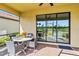 Screened patio with seating area and backyard view at 24269 Spartina Dr, Venice, FL 34293