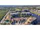 Aerial view of a waterfront community featuring a canal and lush landscaping at 25188 Marion Ave # C206, Punta Gorda, FL 33950