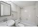 Clean bathroom with white tub and vanity at 25188 Marion Ave # C206, Punta Gorda, FL 33950