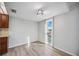 Bright dining area with wood-look floors and water view at 25188 Marion Ave # C206, Punta Gorda, FL 33950