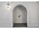 White double door entry with arched top and a light fixture at 25188 Marion Ave # C206, Punta Gorda, FL 33950