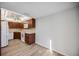 Kitchen with dark wood cabinets, white appliances, and a ceiling fan at 25188 Marion Ave # C206, Punta Gorda, FL 33950