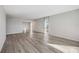 Spacious living room featuring light grey wood-look floors at 25188 Marion Ave # C206, Punta Gorda, FL 33950