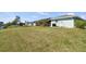 Expansive grassy backyard, perfect for outdoor activities and relaxation at 254 Mark Twain Ln, Rotonda West, FL 33947