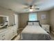 Guest bedroom with queen bed and neutral decor at 254 Mark Twain Ln, Rotonda West, FL 33947