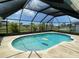 Relaxing screened in pool and patio area at 254 Mark Twain Ln, Rotonda West, FL 33947