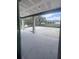 Covered patio with view of backyard at 2814 Vogler Ln, North Port, FL 34286