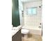 Clean bathroom with white tile and bathtub at 2933 Vizza Ln, North Port, FL 34286