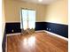 Bright bedroom featuring hardwood floors and a window at 2933 Vizza Ln, North Port, FL 34286