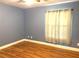 Bedroom with hardwood floors and light blue walls at 2933 Vizza Ln, North Port, FL 34286