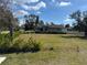 Empty lot next to a house, ready to build at 2933 Vizza Ln, North Port, FL 34286