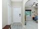 Bright condo entryway with white door and adjacent sitting area at 300 San Lino Cir # 322, Venice, FL 34292