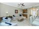 Spacious living room featuring a comfy sectional sofa and tile floors at 300 San Lino Cir # 322, Venice, FL 34292