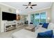 Open living room and kitchen area with lake view at 300 San Lino Cir # 322, Venice, FL 34292