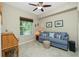 Office with desk, sofa, and ceiling fan at 300 San Lino Cir # 322, Venice, FL 34292