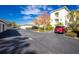 Exterior view of parking lot with building and landscaping at 300 San Lino Cir # 322, Venice, FL 34292