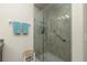 Walk-in shower with glass enclosure and built-in seat at 300 San Lino Cir # 322, Venice, FL 34292