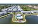 Community pool and lakefront gazebo in an aerial view at 3310 Loveland Blvd # 802, Punta Gorda, FL 33980