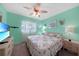 Bright bedroom featuring a king-size bed and large TV at 3310 Loveland Blvd # 802, Punta Gorda, FL 33980