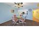 Bright dining area with glass table and four chairs, open to kitchen at 3310 Loveland Blvd # 802, Punta Gorda, FL 33980