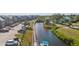 Aerial view of community with waterfront access, parking, and boat at 4410 Warren Ave # 403, Port Charlotte, FL 33953