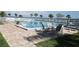 Inviting community pool with ample lounge chairs and waterfront views at 4410 Warren Ave # 403, Port Charlotte, FL 33953