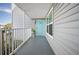 Condo exterior showing light blue door and walkway at 4410 Warren Ave # 403, Port Charlotte, FL 33953