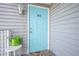 Light blue front door to condo unit at 4410 Warren Ave # 403, Port Charlotte, FL 33953